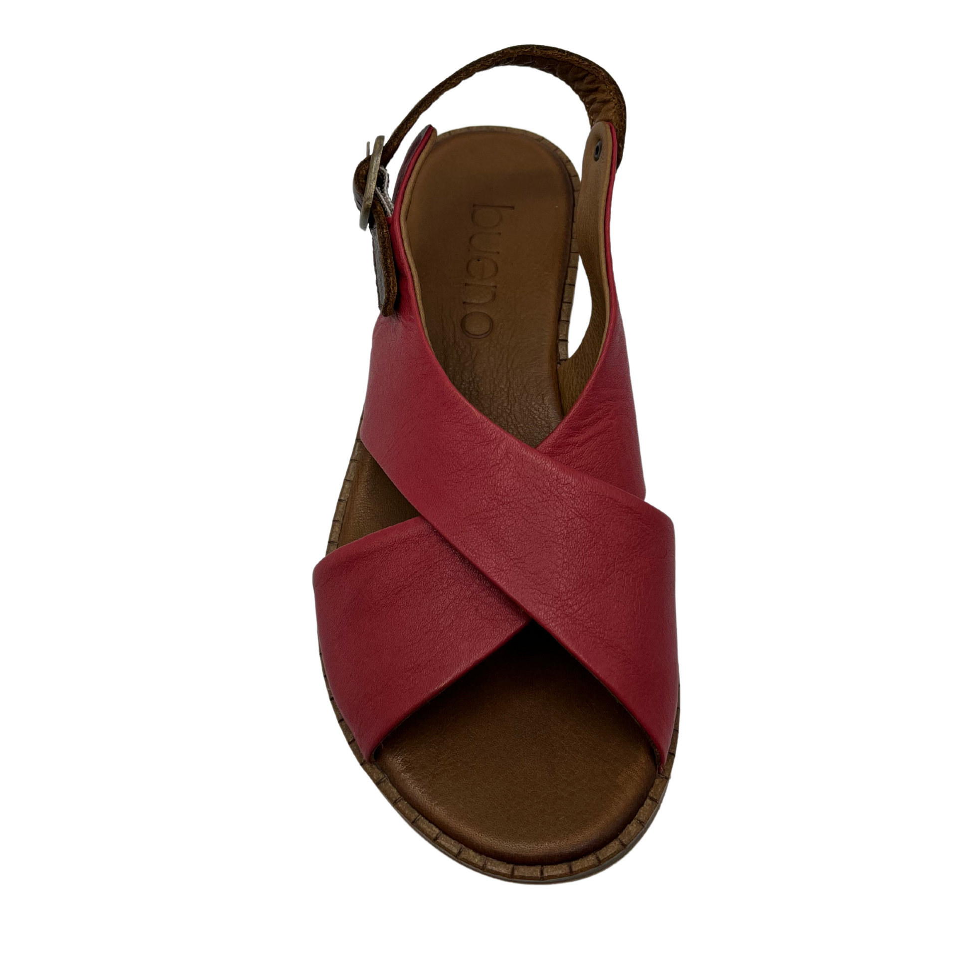 Top view of red leather sandal with cross strap design, slight wedge heel and brown slingback strap