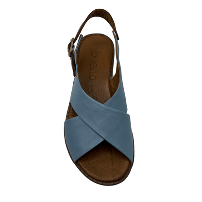 Top view of light blue leather sandal with cross strap design, slight wedge heel and brown slingback strap