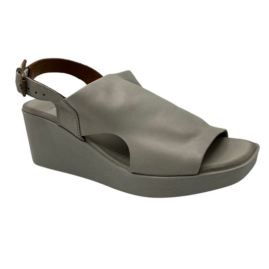 45 degree angled view of leather sandal with square toe and slingback buckle strap