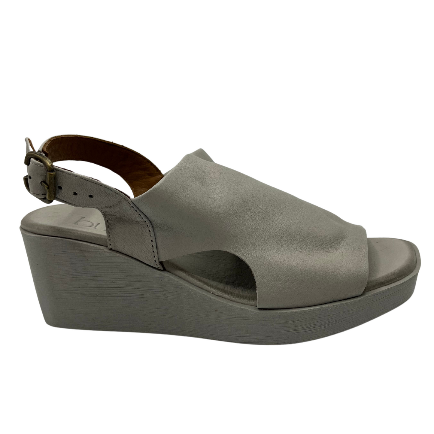 Right facing view of leather sandal with square toe and slingback buckle strap