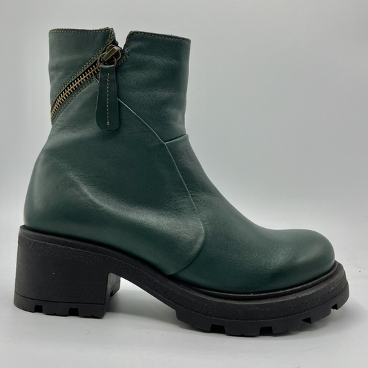 Green leather boot with a zipper on a gray background