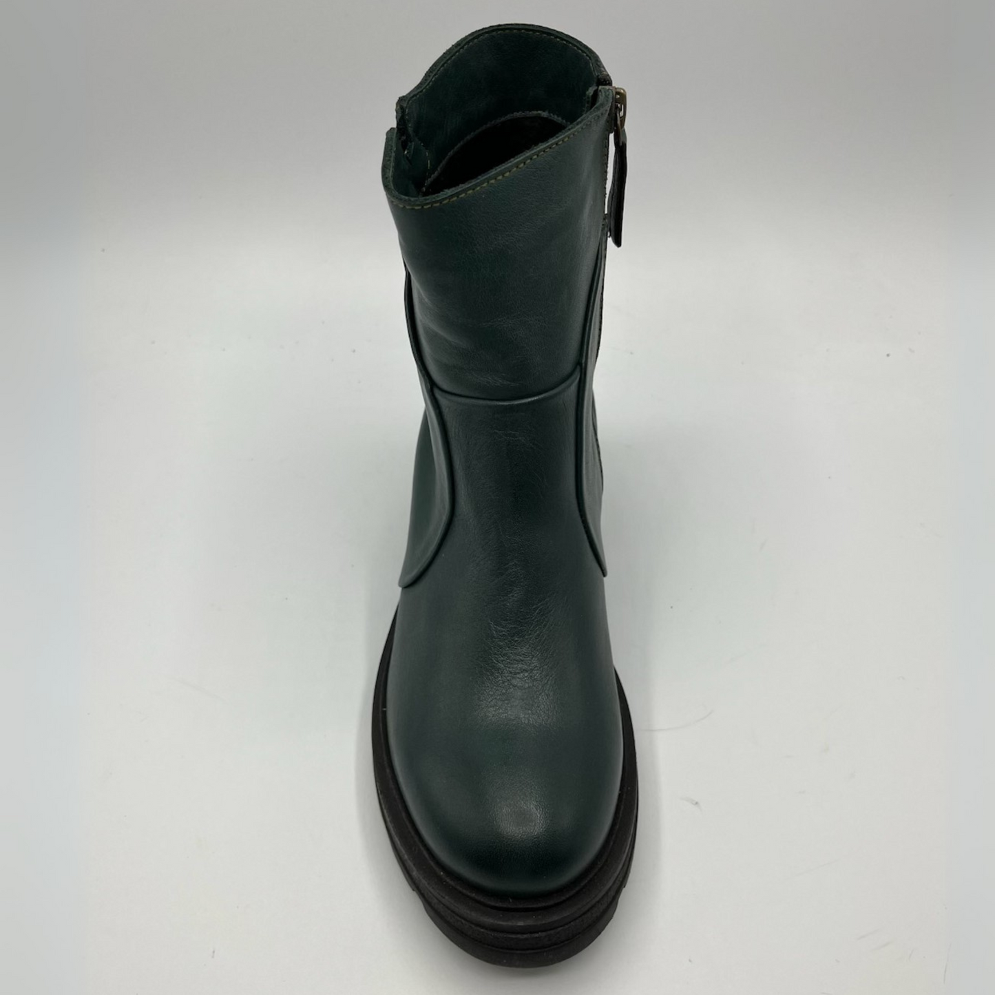 Green leather boot on a white background