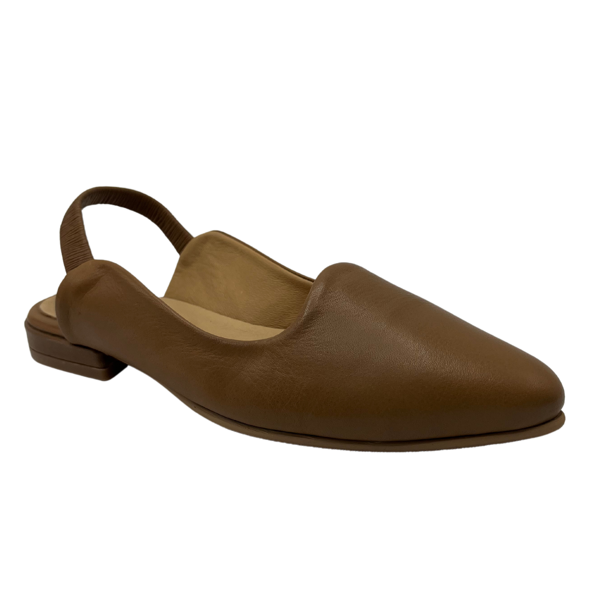 45 degree angled view of walnut leather shoe with pointed toe and slingback strap