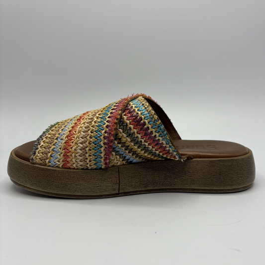 Multicolored striped sandal with a brown sole on a white background