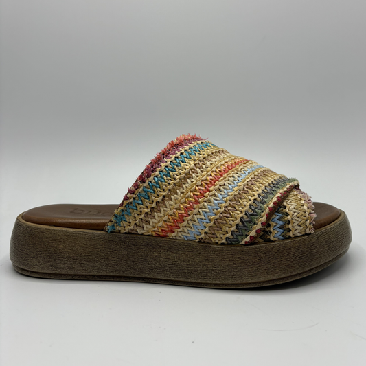 Multicolored woven sandal with a wooden sole on a gray background