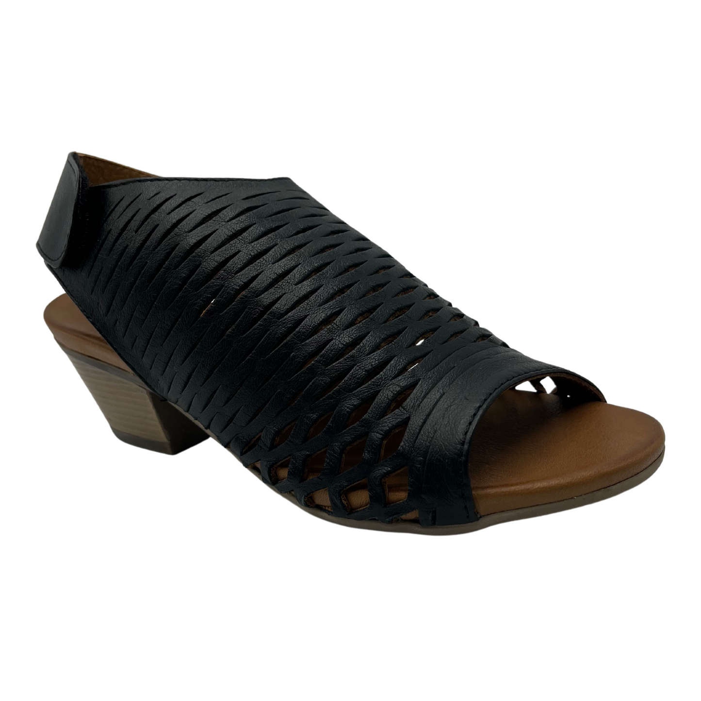 45 degree angled view of black leather sandal with cutout details and block heel