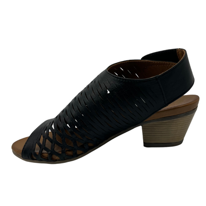 Left facing view of black leather sandal with cutout details and block heel