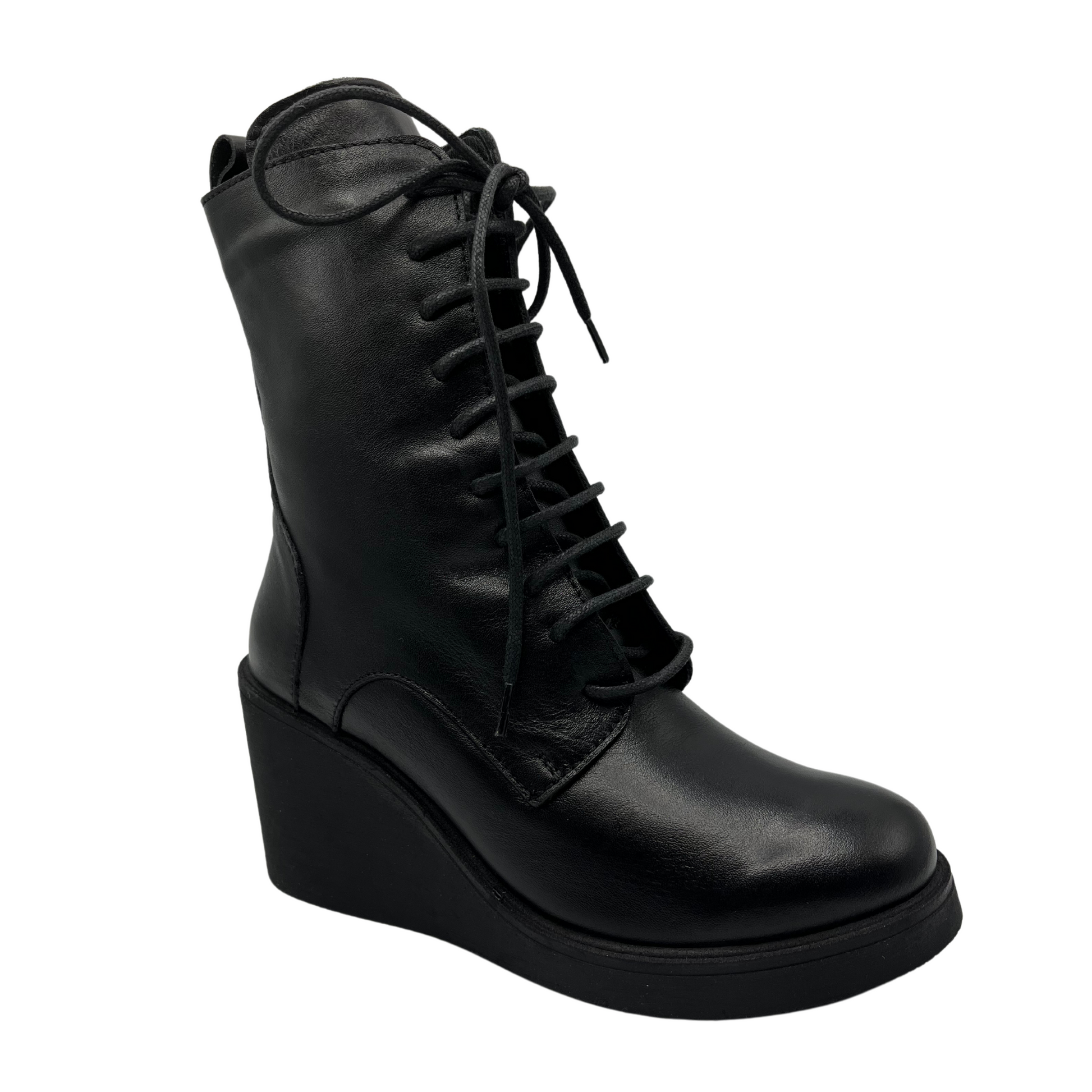 45 degree angled view of black leather lace up boot with wedge heel and side zipper closure