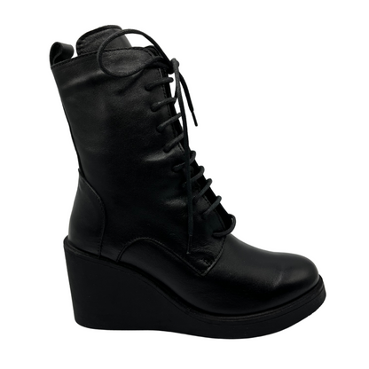 Right facing view of black leather lace up boot with wedge heel and side zipper closure