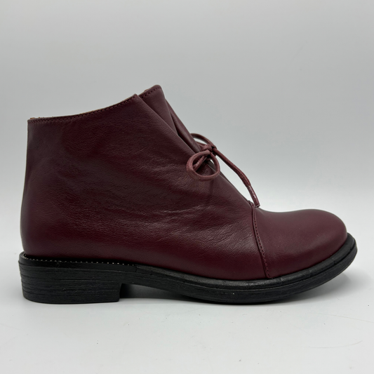 Brown ankle boot on a white background