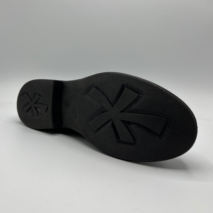 Black shoe sole with a brand logo on a gray background