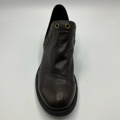 Brown leather boot with grommets on a white background