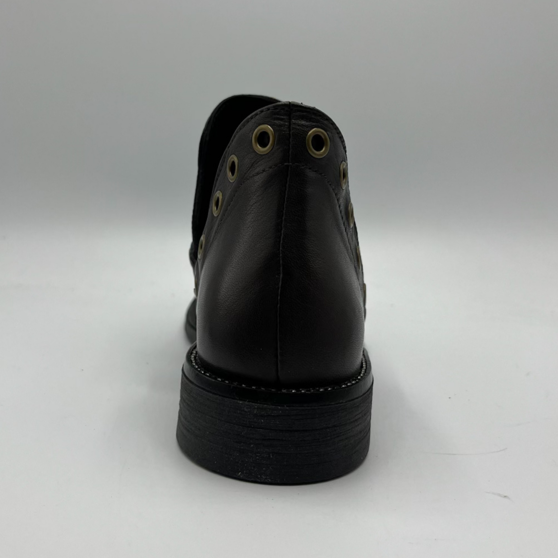 Brown leather shoe on a white background
