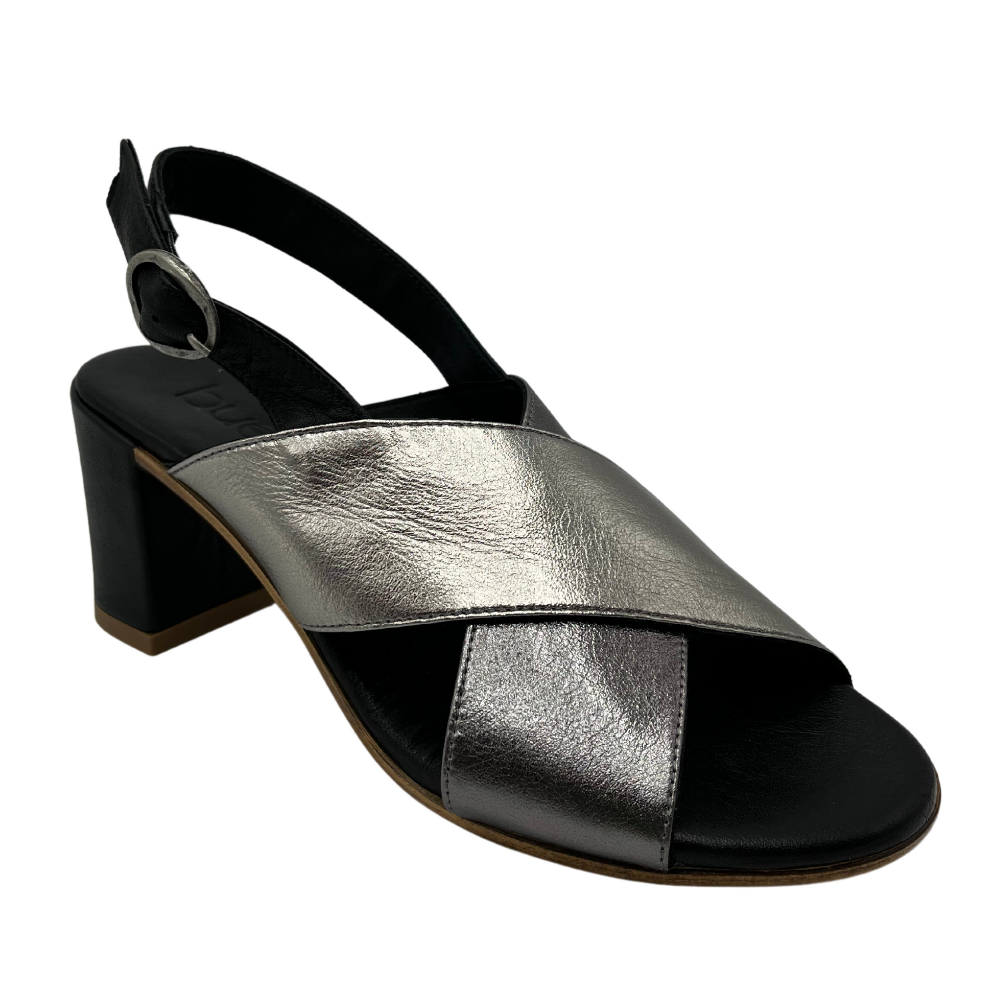 45 degree angled view of black and silver sandal with block heel and slingback strap