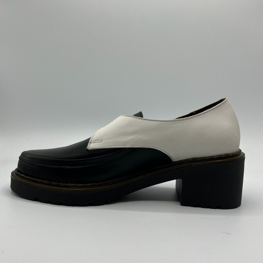 Black and white shoe on a gray background