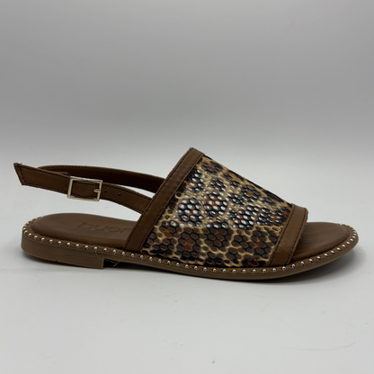 Brown sandal with leopard print strap on a gray background