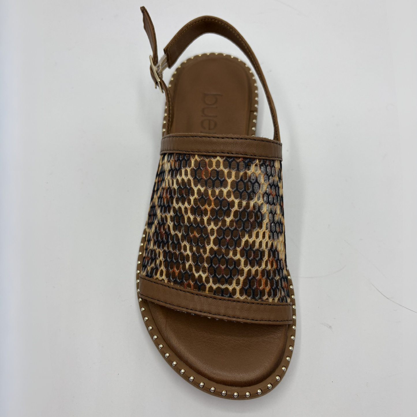 Leopard print sandal with brown sole on a white background
