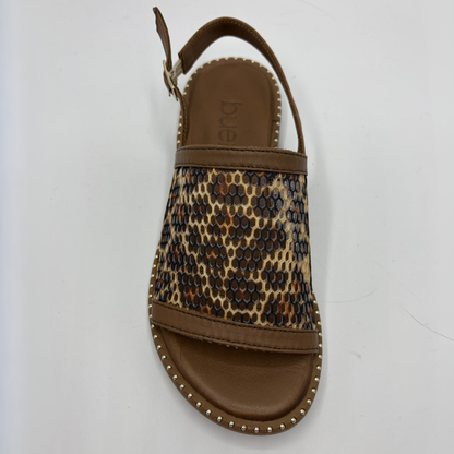 Leopard print sandal with brown sole on a white background