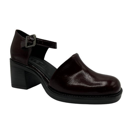 45 degree angled view of burgundy patent leather shoe with ankle strap, thick block heel and rounded toe.