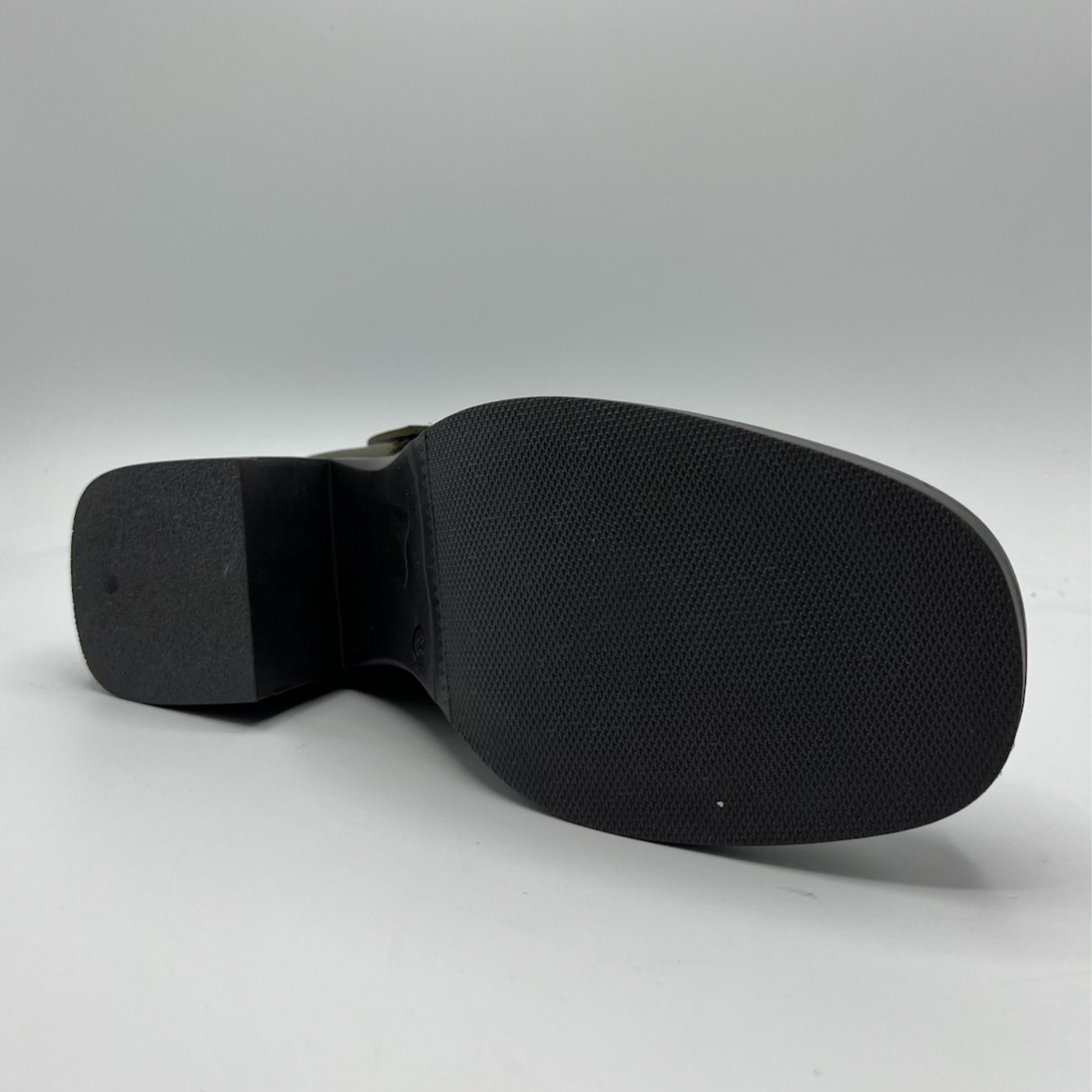 Black shoe sole on a gray background