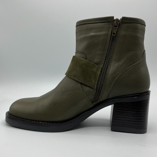 Green ankle boot with a block heel on a white background
