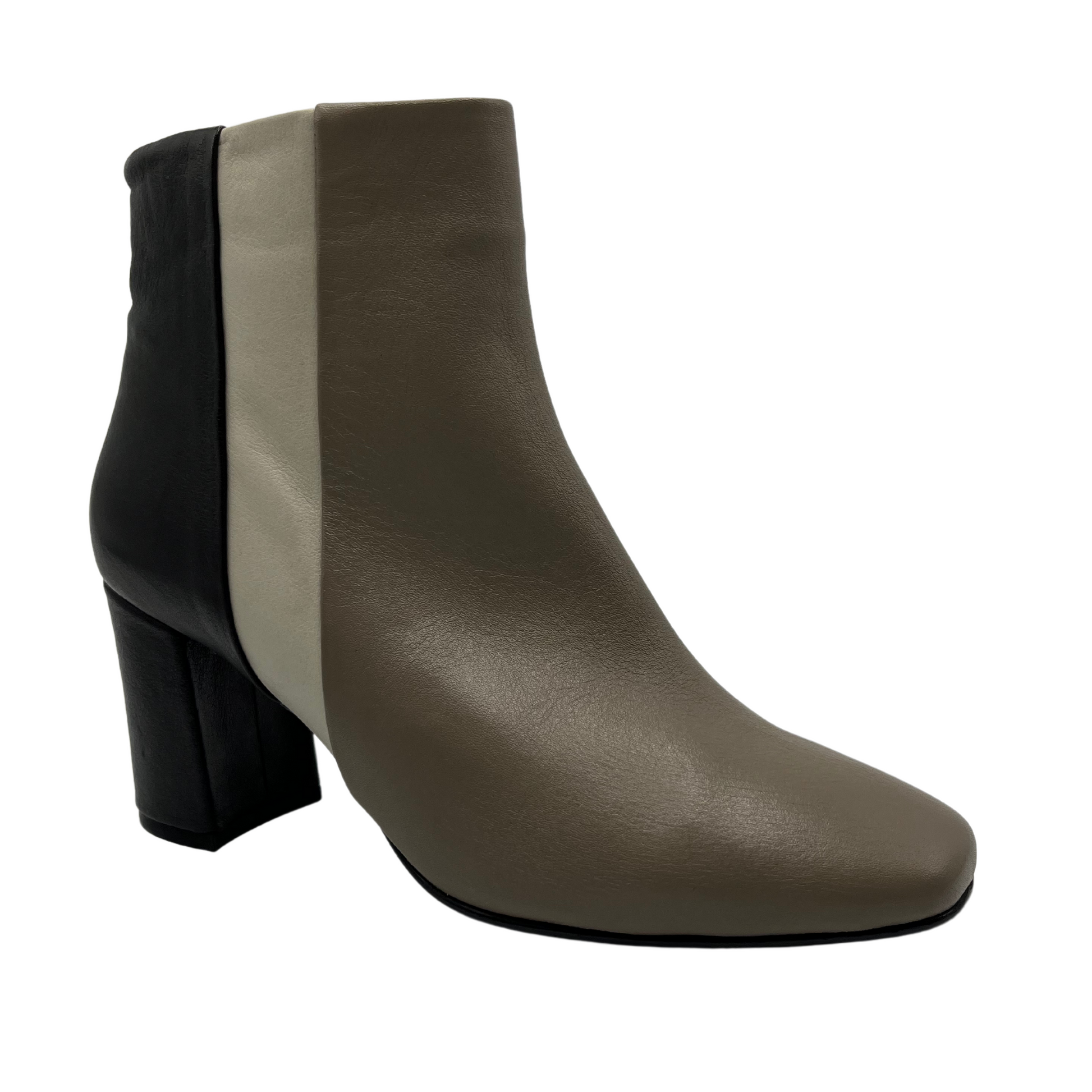 45 degree angled view of colour block leather bootie. 3 inch heel height, soft square toe and side zipper closure.