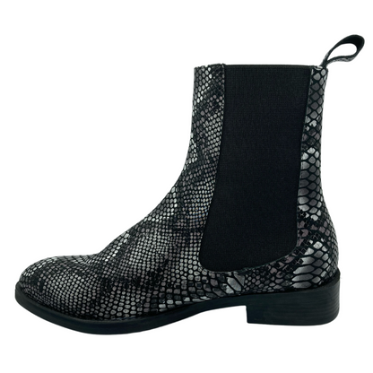 Left facing view of snake print leather boot with elastic side gore and short block heel