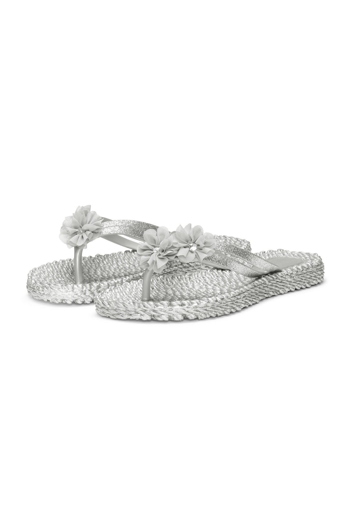 Profile view of a pretty flip flop in silver/grey with matching synthetic floral detail. Shop ILSE JACOBSEN shoes at waterlilyshoes.com