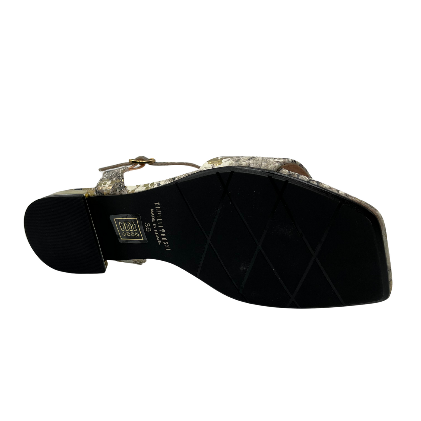 Bottom view of flat snake skin design leather sandal with square toe and gold detail on heel