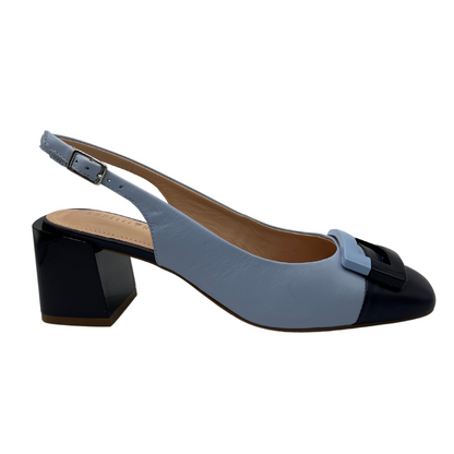 Right facing view of light blue and navy slingback heel with block heel and square detail on toe