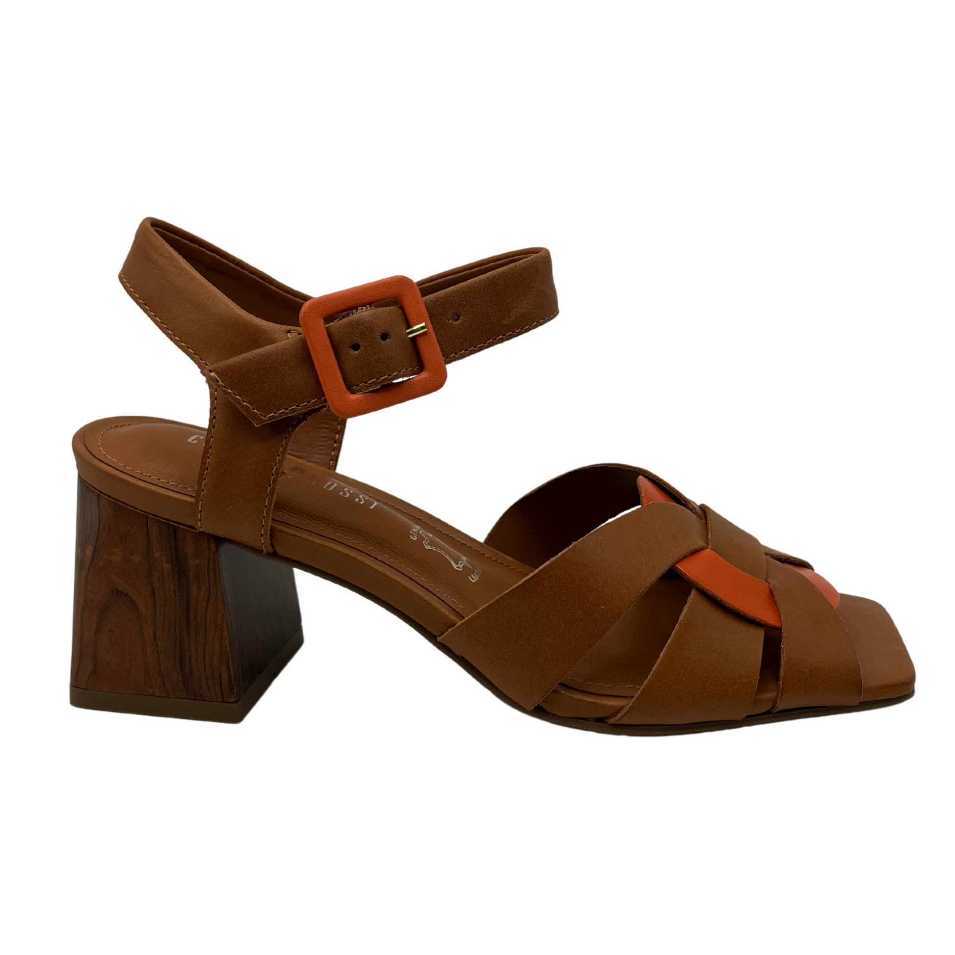 Right facing view of brown leather sandal with square toe and block heel. Orange leather details on strap and toe