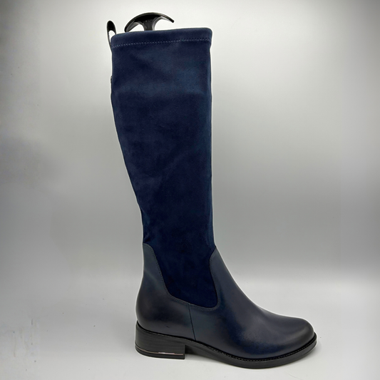 Right facing view of a tall navy boot with an inner zipper closure