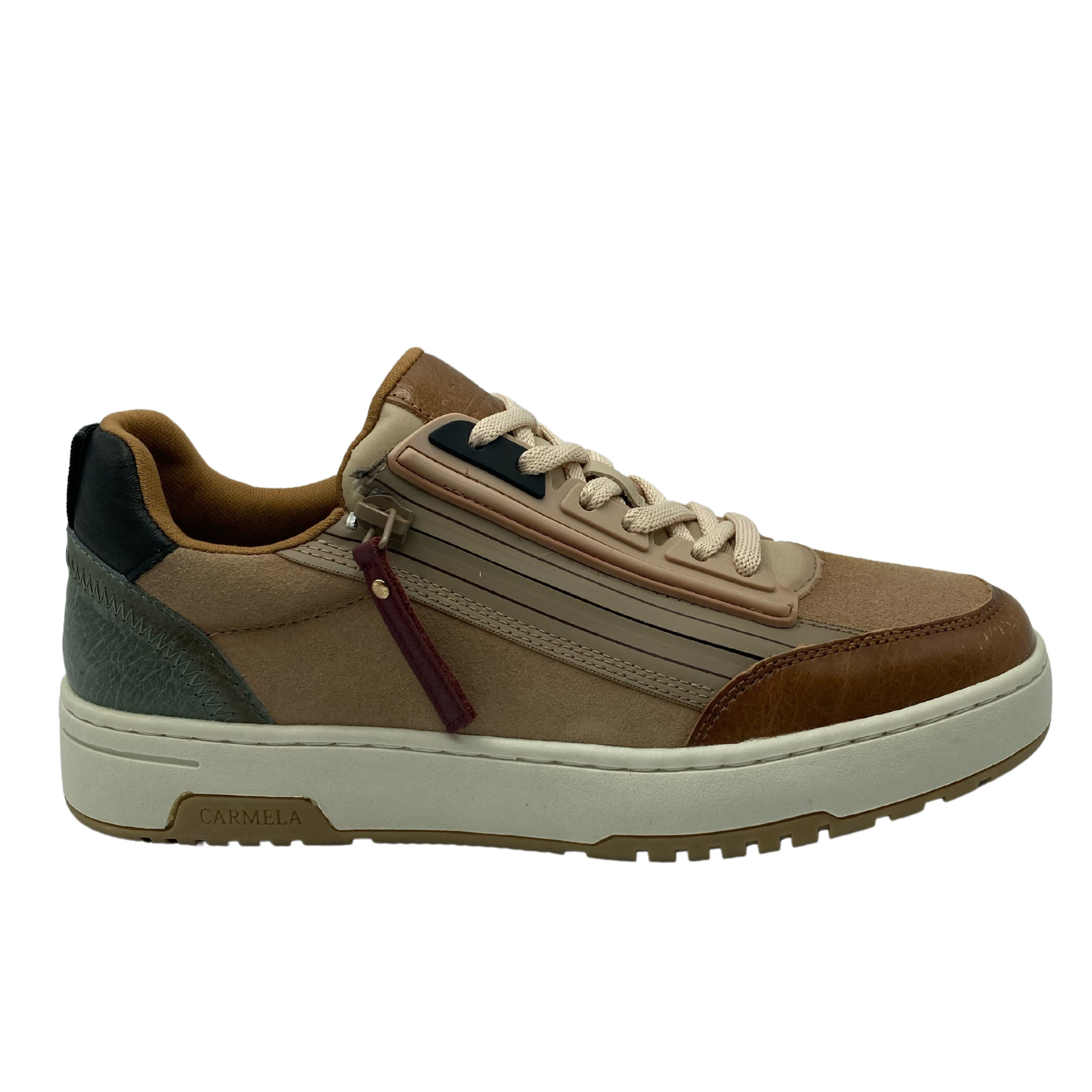 Right facing view of brown leather sneaker with white rubber outsole