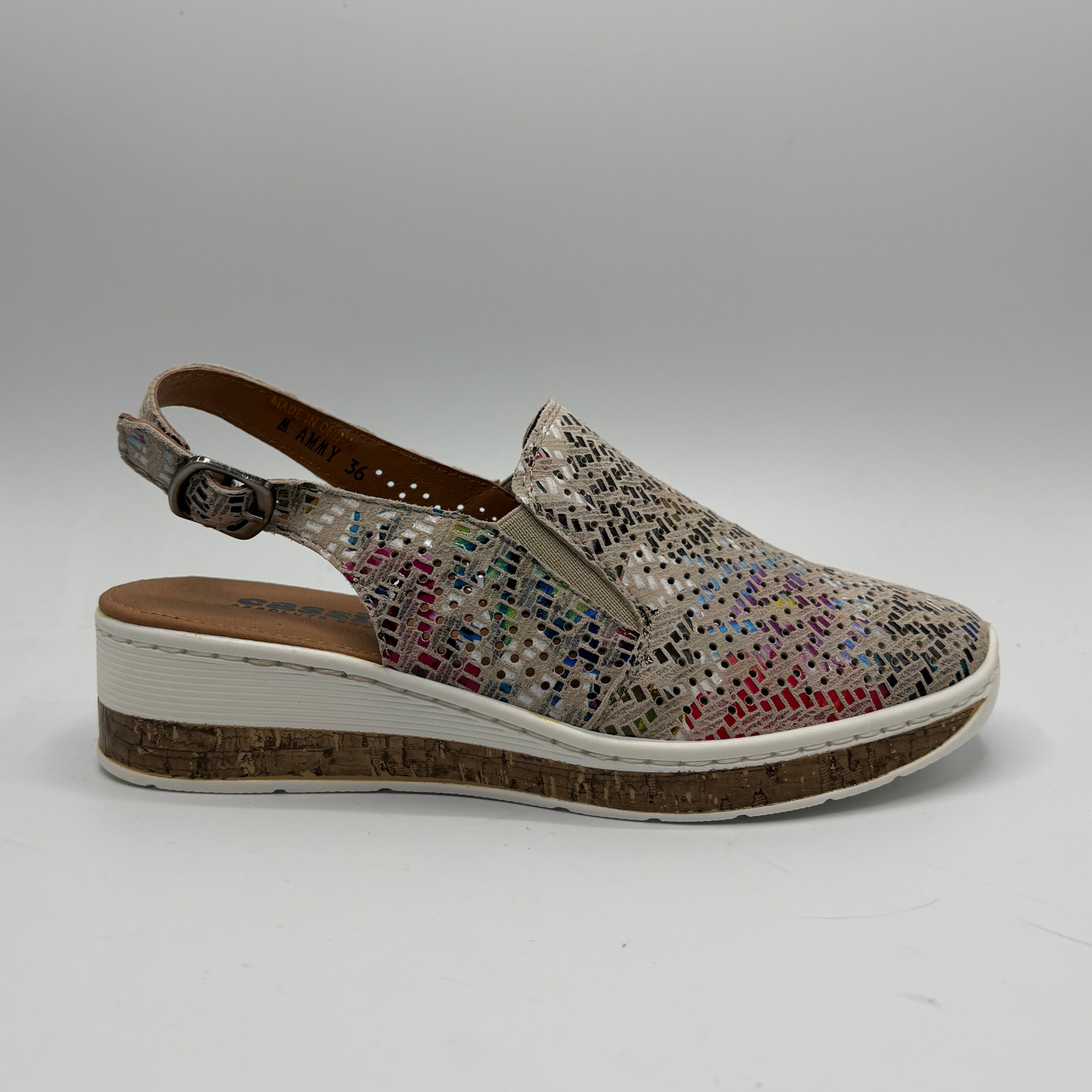 Multicolored shoe with a platform sole on a white background