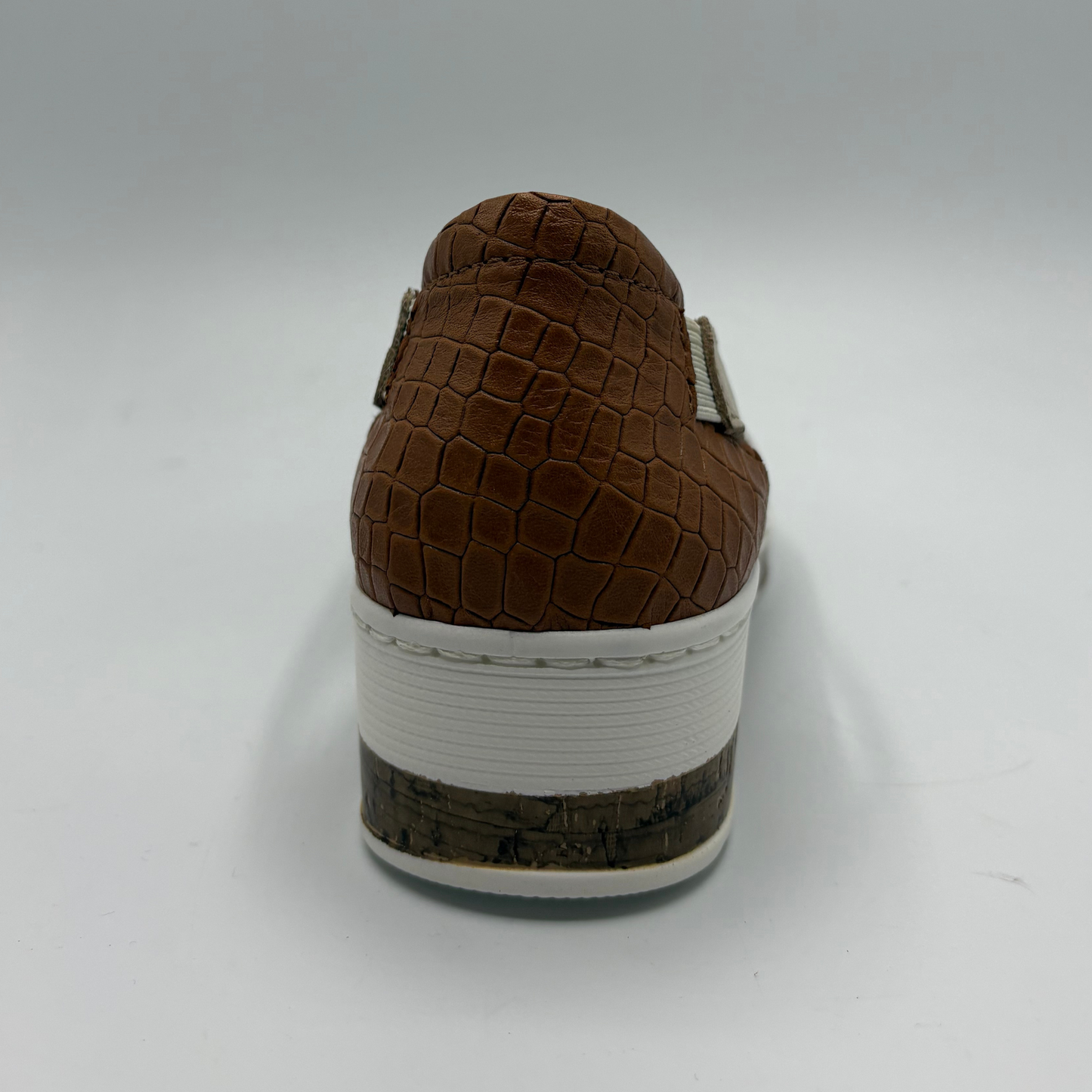 Brown textured shoe on a white background