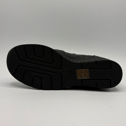 Bottom view of a black ankle boot with a side zipper closure and slight wedge sole