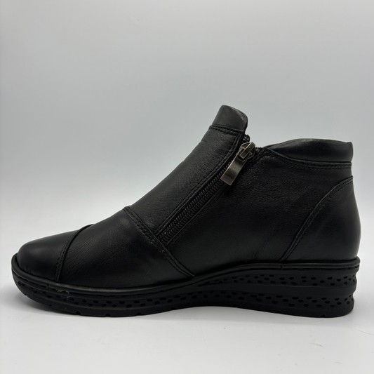 Left facing view of a black ankle boot with a side zipper closure and slight wedge sole