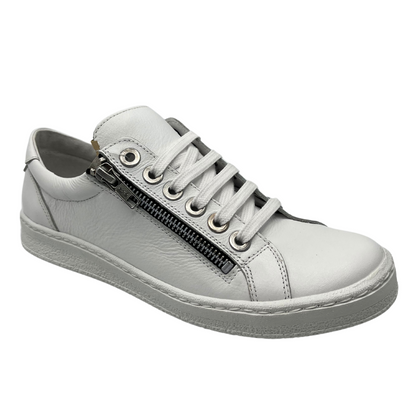 45 degree angled view of white leather sneaker with white rubber outsole and laces