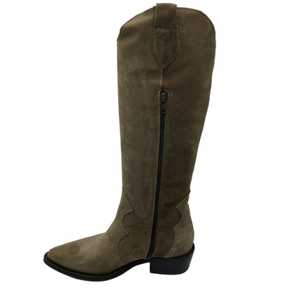 Left facing view of tall sand coloured cowboy boot with low heel and pointed toe and side zipper closure
