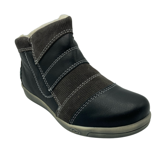45 degree angled view of leather patchwork ankle boot with rubber outsole and wool lining