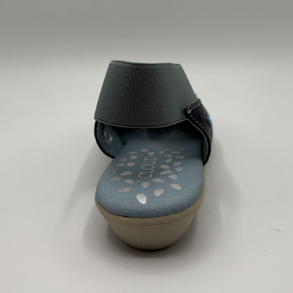 Navy sandal with a blue sole on a white background