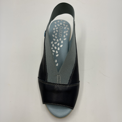 Navy sandal with a gray insole on a light gray background