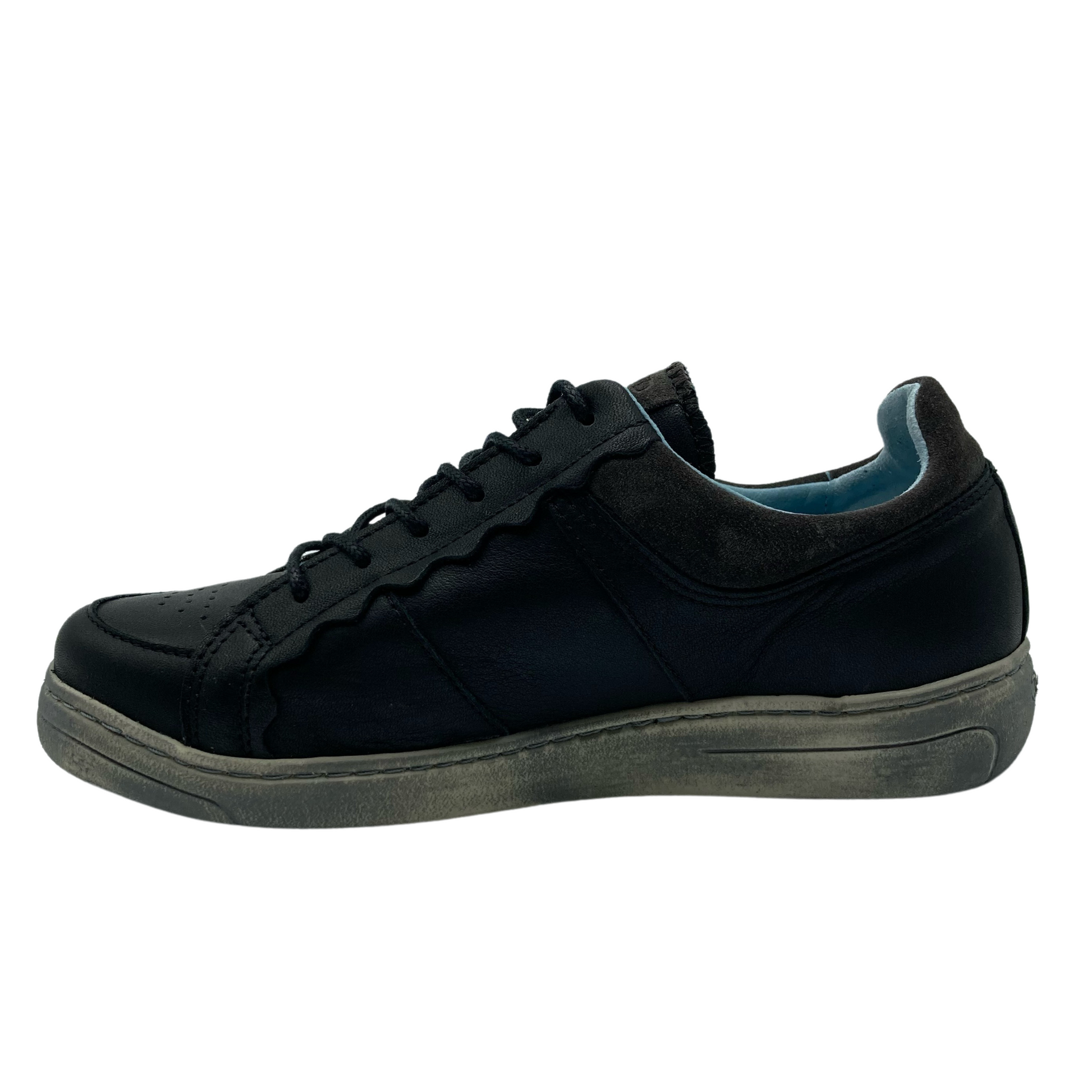 Left facing view of black leather sneaker with blue textile lining and grey rubber outsole