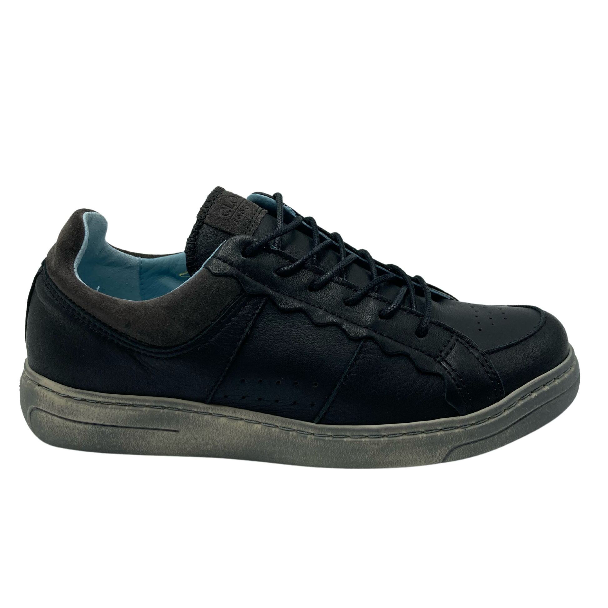 Right facing view of black leather sneaker with matching laces and grey rubber outsole