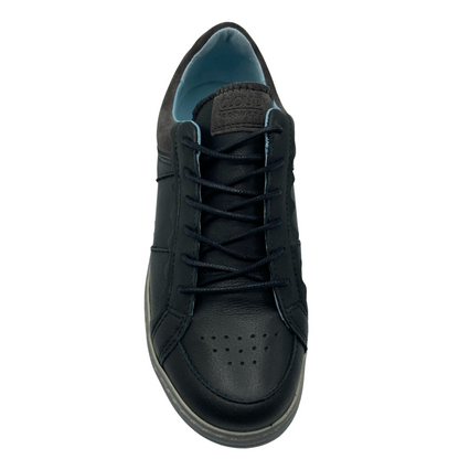 Top view of black leather sneaker with black laces and grey rubber outsole
