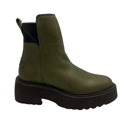 Right facing view of a khaki leather ankle boot with pull on heel tab and black lightweight lug sole