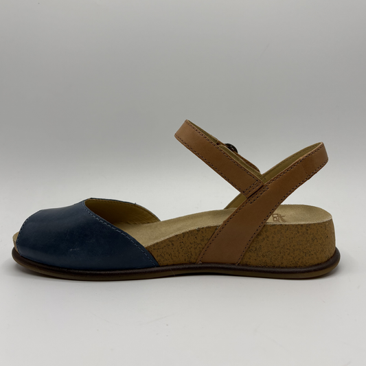 Left facing view of a low wedge sandal with a peep toe