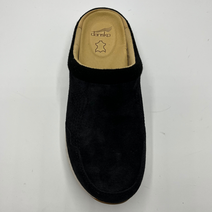 Black slipper with tan interior on a white background