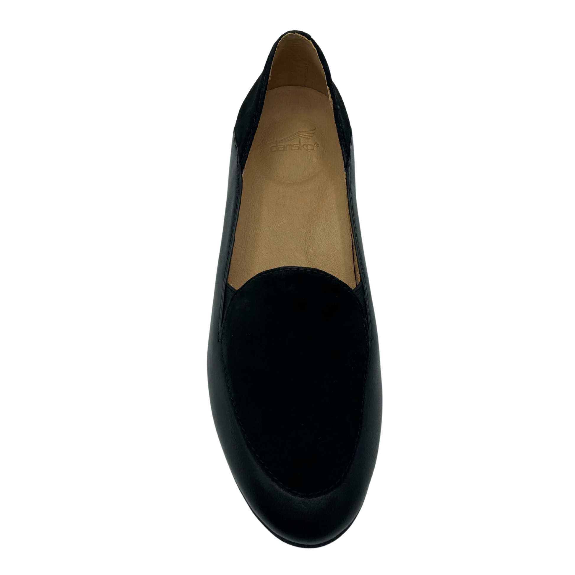 Top down view of black leather loafer with tan leather lining