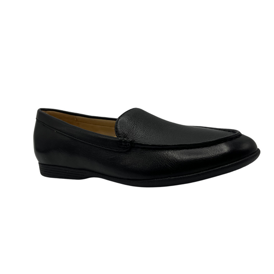 45 degree angled view of black leather loafer with black rubber outsole and tan lining